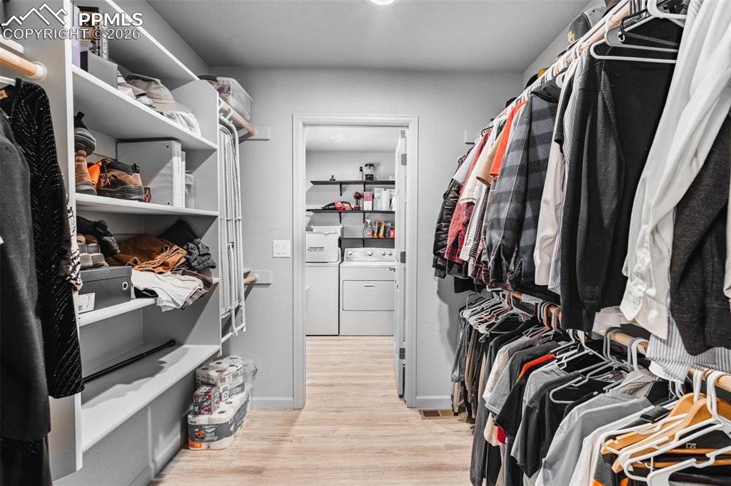 Image 20 of 50: Primary walk through closet