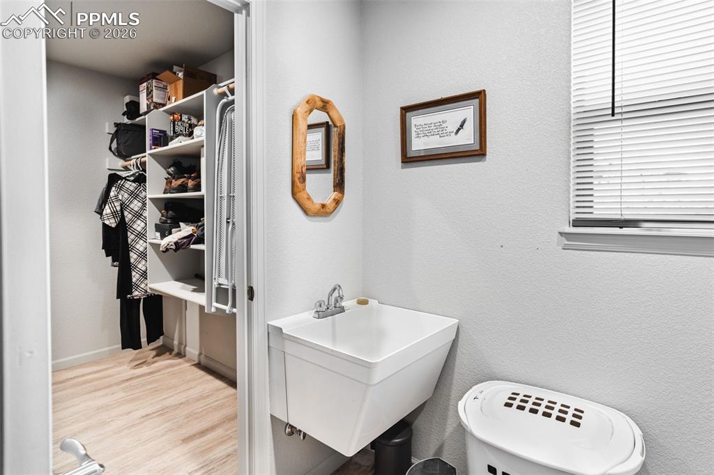 Image 22 of 50: Laundry with utility sink