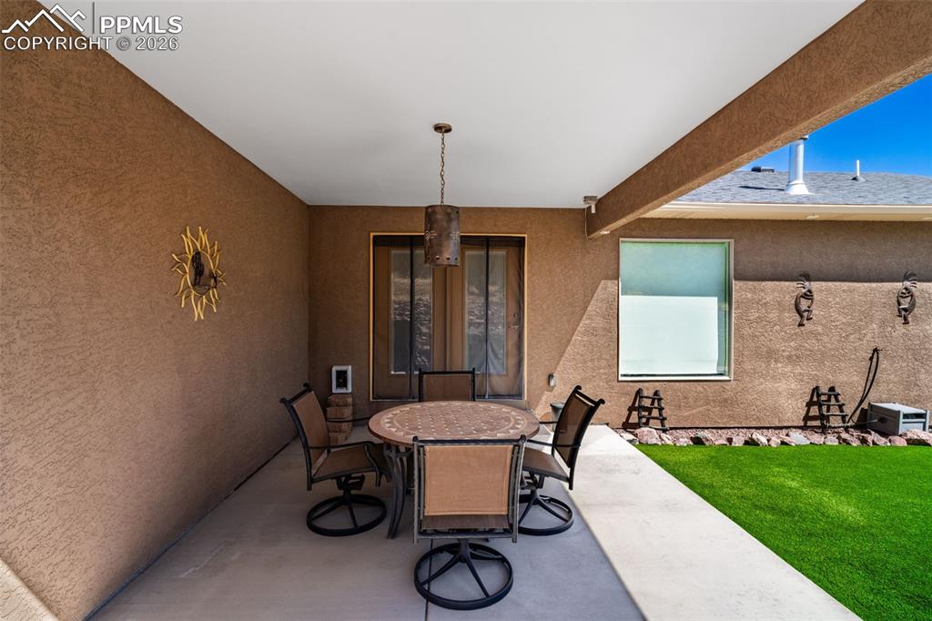 Image 31 of 50: Covered back patio