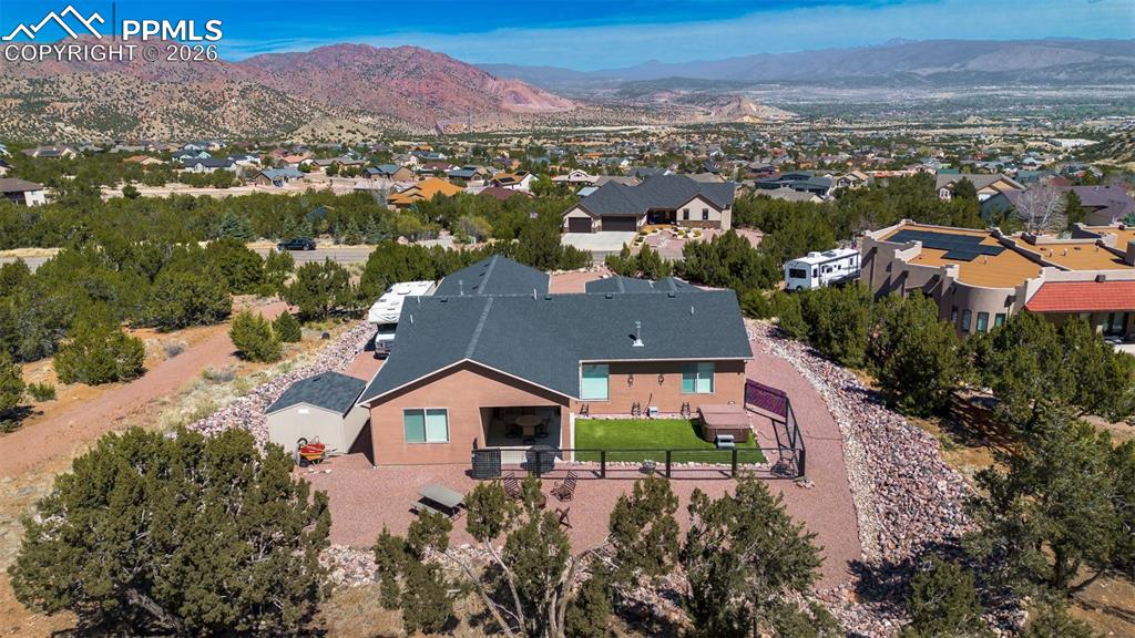 Image 38 of 50: Aerial perspective of suburban area with a mountainous background