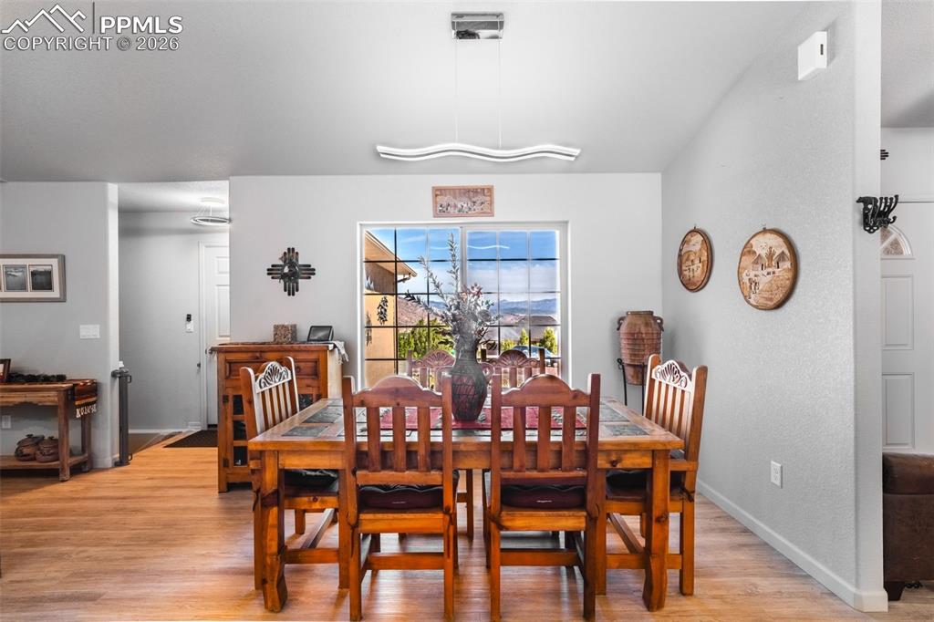Image 7 of 50: Dining room with mountain views of Pikes Peak and the front range