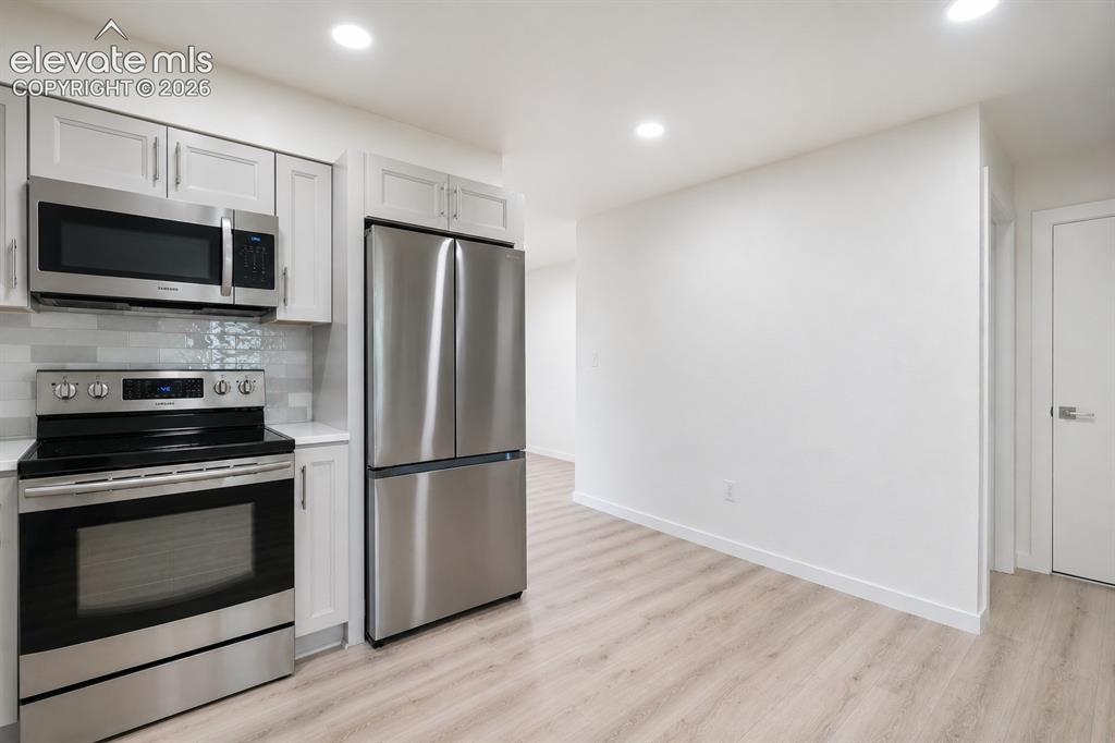 Image 13 of 47: Kitchen featuring stainless steel appliances including a French door refrig