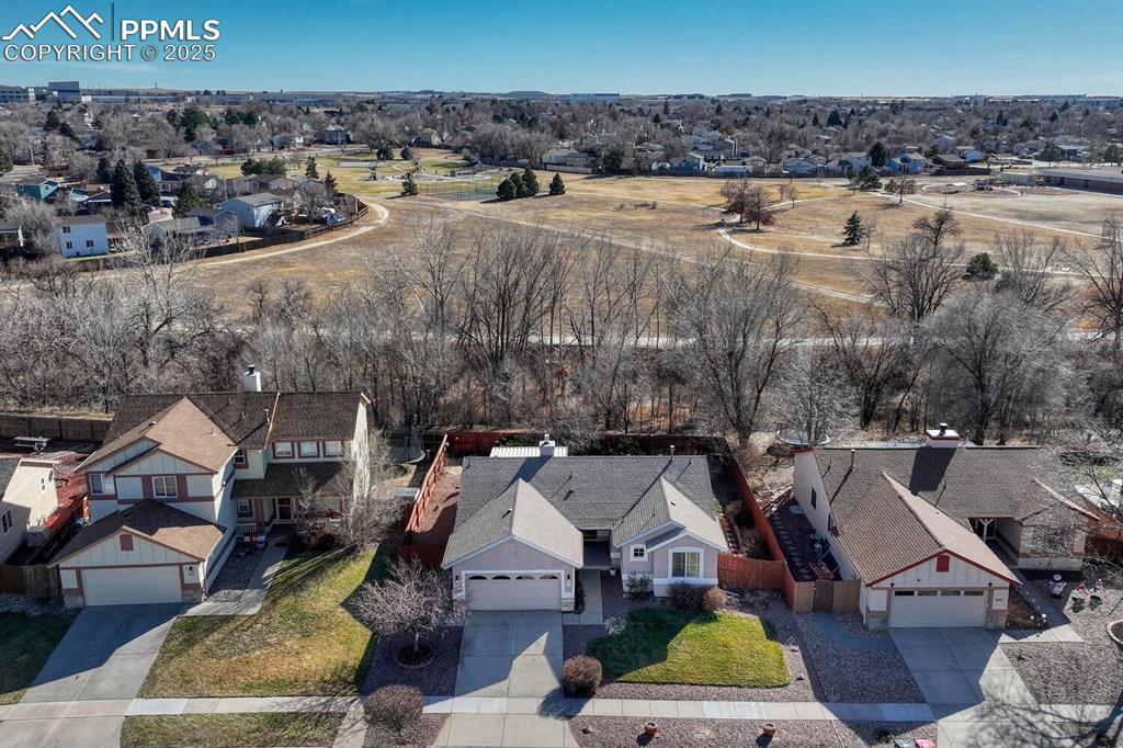 Image 2 of 50: The property backs to Sand Creek and wonderful 22-acre Wildflower Park.
