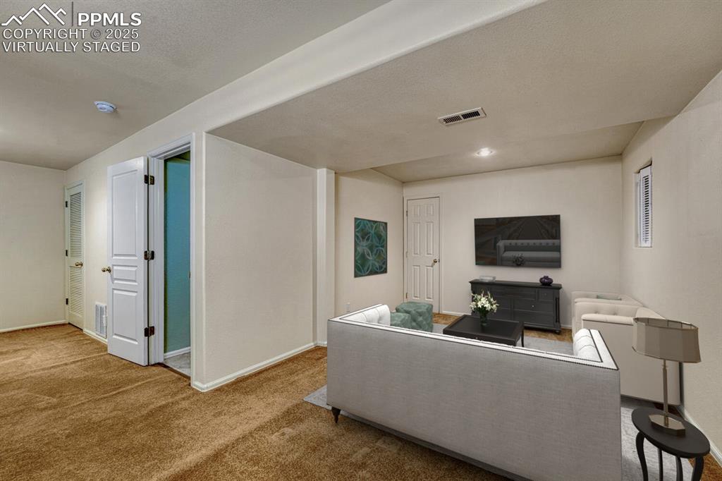 Image 25 of 50: Family room virtually staged