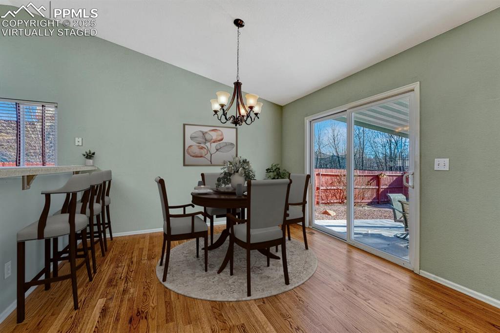 Image 9 of 50: Dining room virtually staged