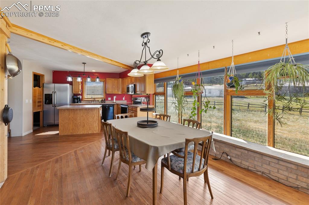 Image 14 of 46: Dining Area can easily accomodate an 8-10 person table