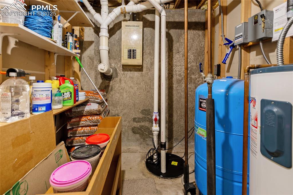 Image 40 of 46: Mechanical Room with Well Pressure Tank and Generator Panel