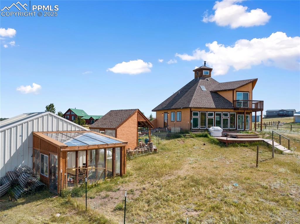 Image 41 of 46: Back View of Property showing Greenhouse