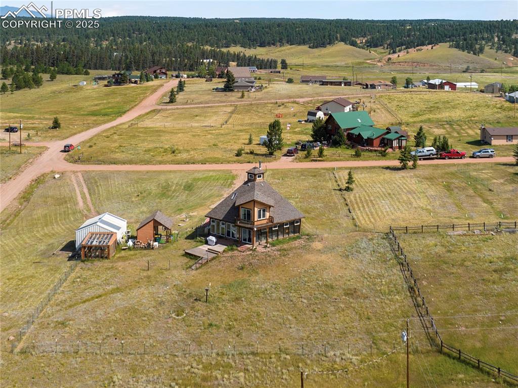 Image 42 of 46: Overview showing 20 x 20 Garage, Green House and Workshop with Electric