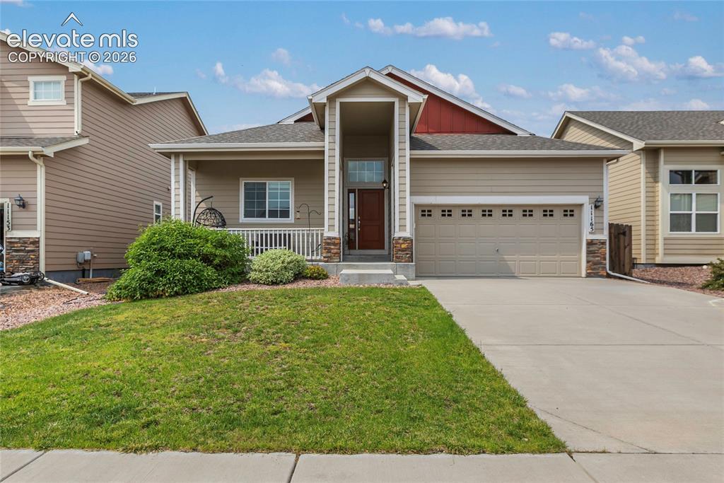 Image 1 of 32: Beautiful front exterior featuring a covered front porch and inviting curb