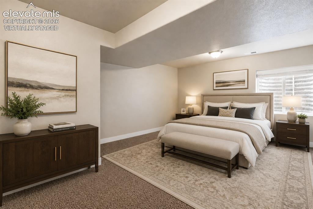 Image 19 of 32: Oversized downstairs bedroom. Virtually Staged