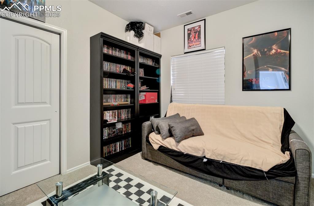 Image 15 of 35: Carpeted bedroom with visible vents