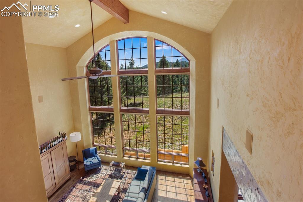Image 12 of 50: Looking down on the living room from the 2nd floor at the top of the stairs