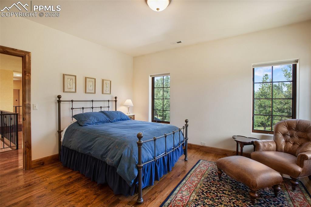 Image 34 of 50: Second of two bedrooms on the upper level served by a Jack