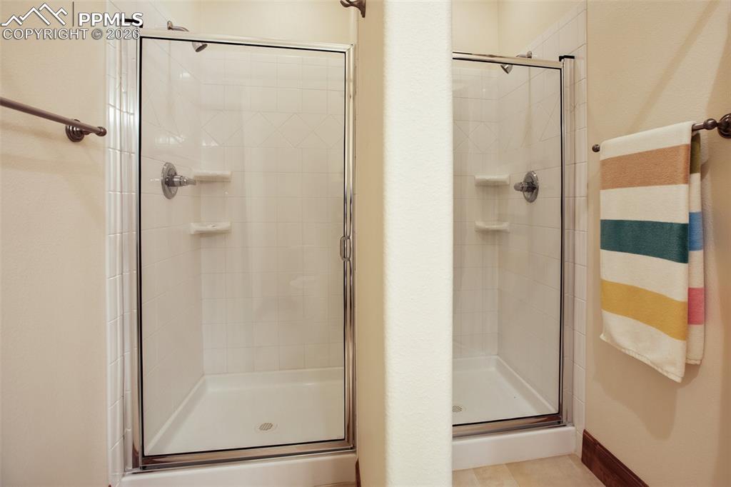 Image 36 of 50: The shower area of the bathroom that serves the Bunkhouse.