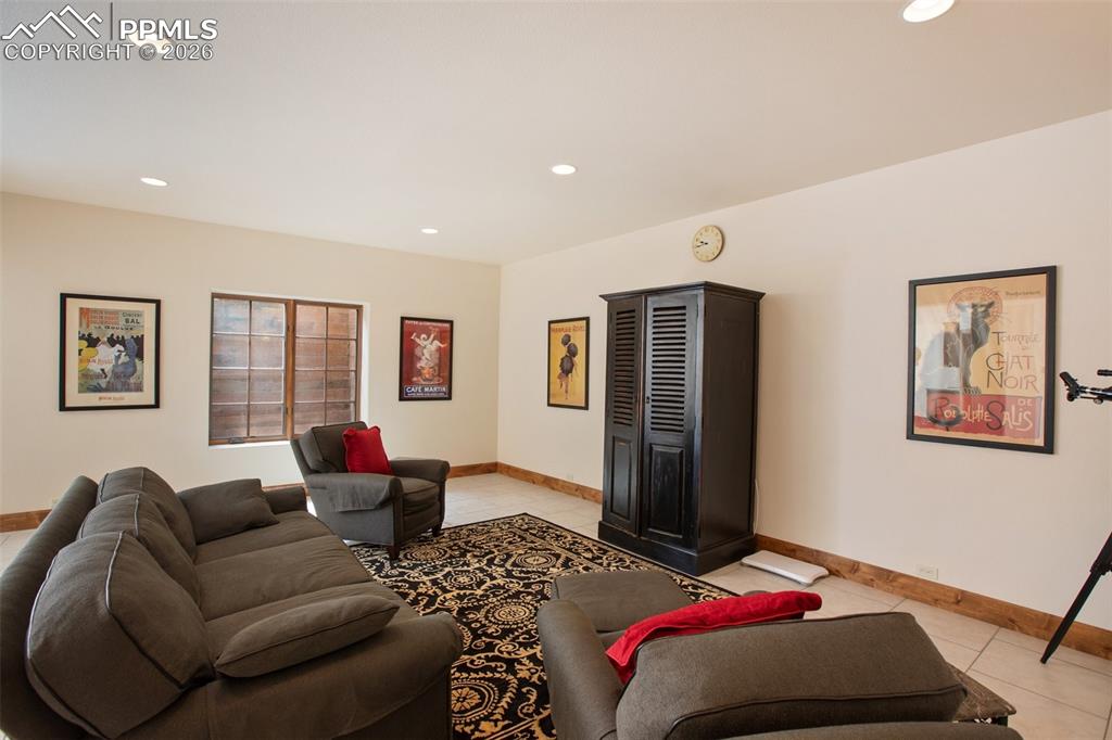 Image 39 of 50: Family/Media/Theatre or other room adjacent to the "Game Room" and wet bar