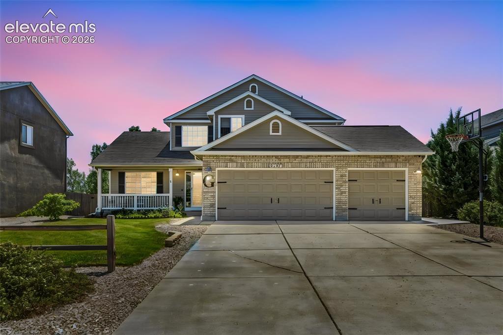 Image 1 of 47: Welcoming Two-Story Home with Covered Front Porch & 3-Car Garage
