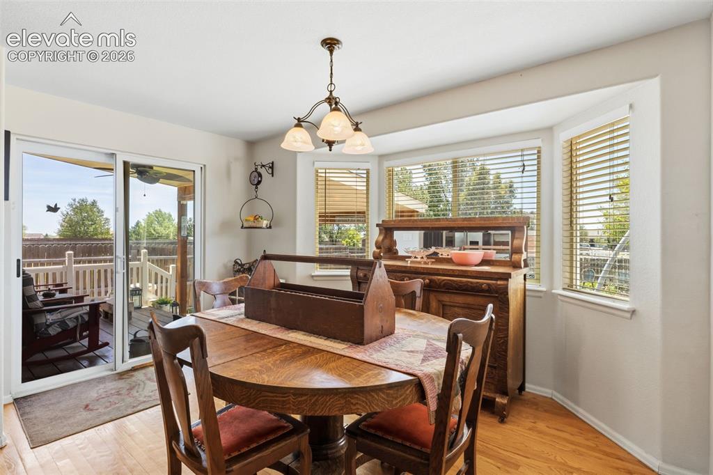 Image 18 of 47: Sunny Eating Area with Walkout to the Covered Patio