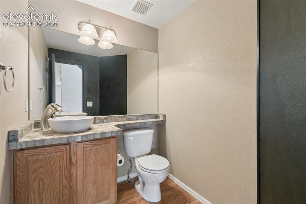 Image 24 of 47: Main Level Powder Bath