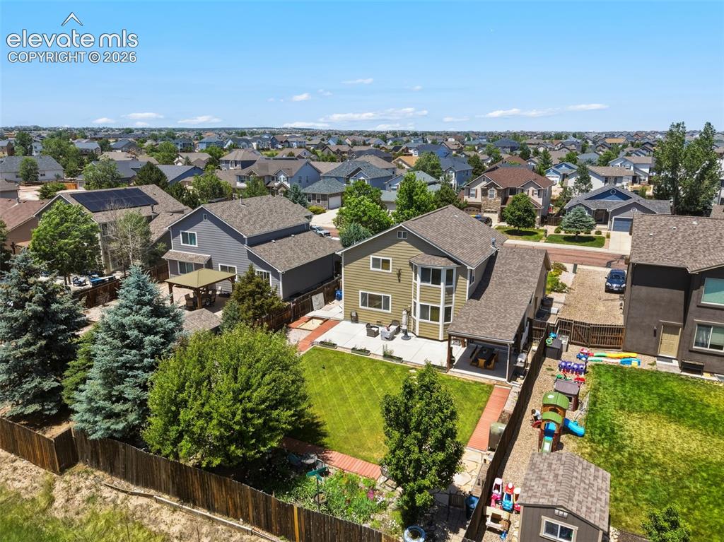 Image 43 of 47: Large Fenced Yard & Covered Outdoor Living Area