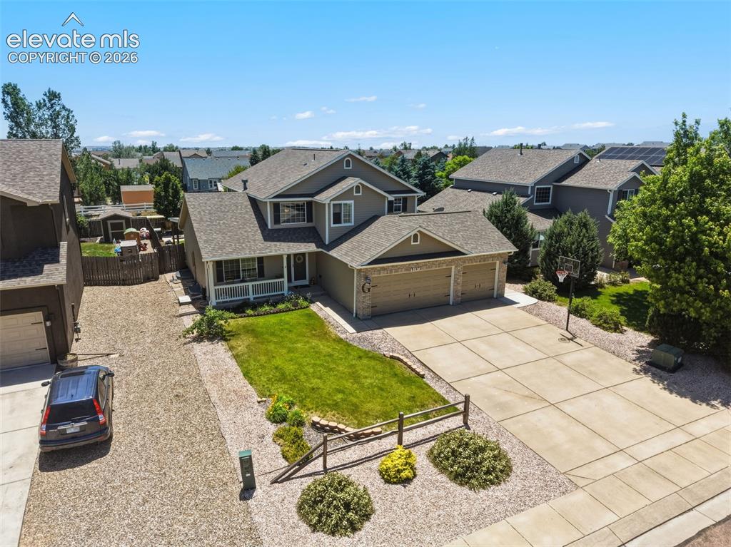 Image 45 of 47: 3-Car Garage, Landscaped Front Yard & Wide Driveway