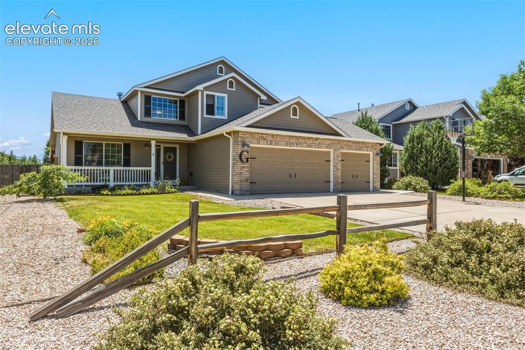 Image 47 of 47: Charming Covered Porch & 3-Car Garage