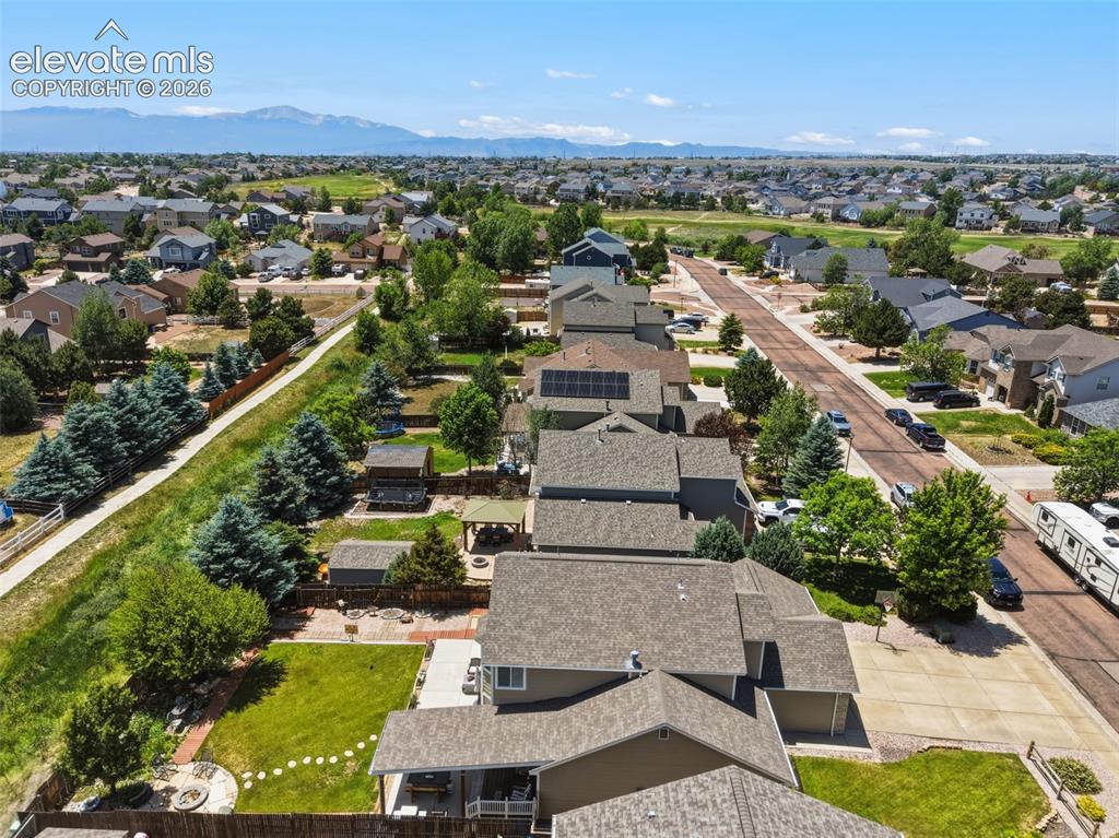 Image 5 of 47: Walking Path Just Behind the Home with Mountain Views Beyond