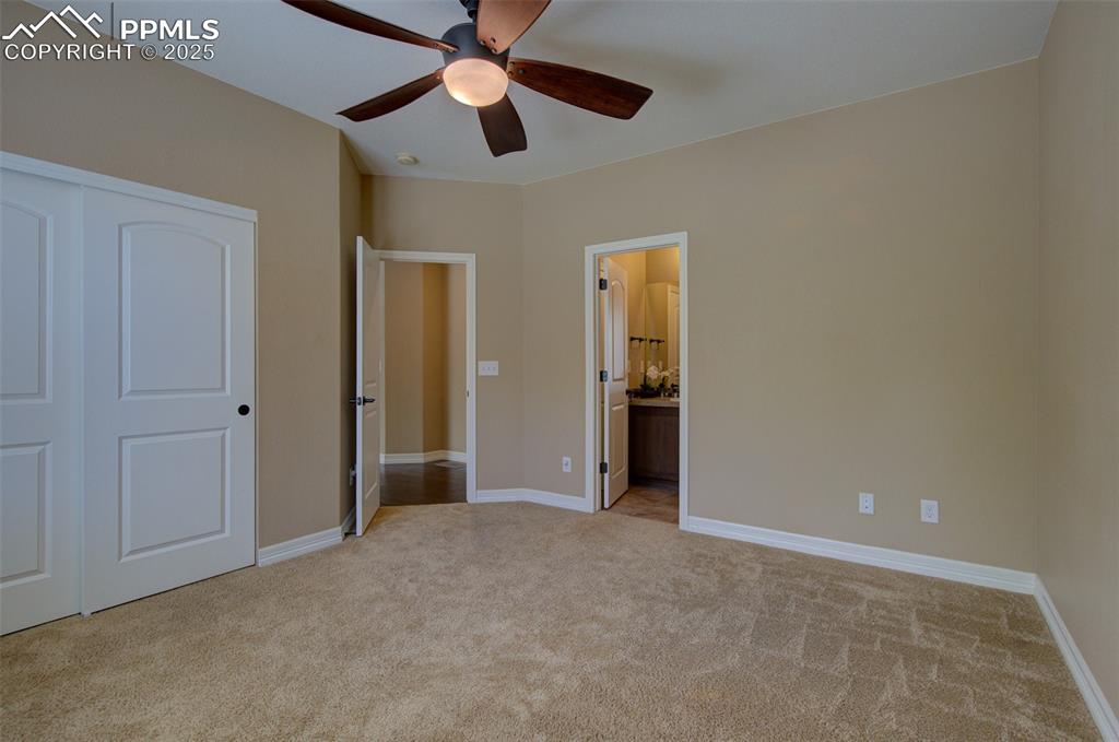 Image 20 of 50: Main level bedroom with direct access to full bathroom
