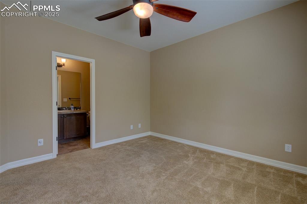 Image 21 of 50: Main level bedroom with direct access to the full bathroom