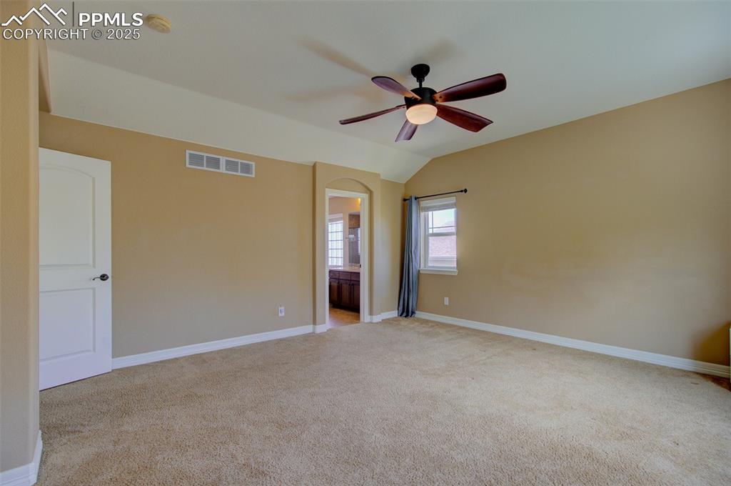Image 31 of 50: Large primary bedroom with private en-suite bathroom
