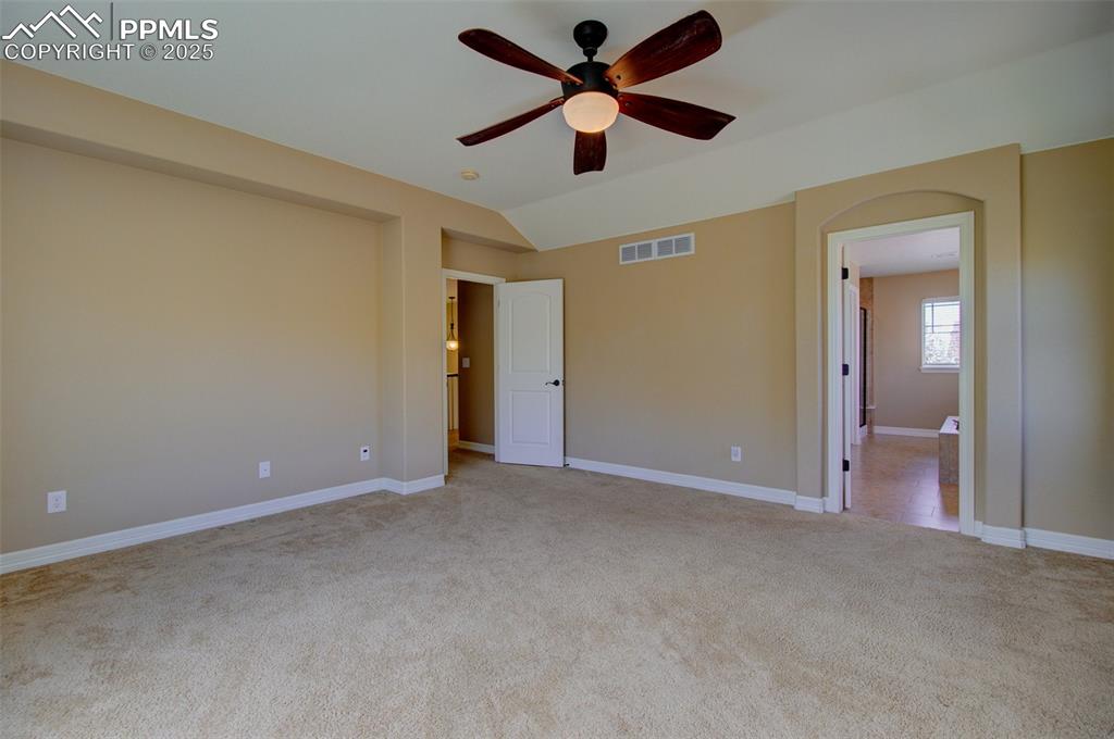 Image 32 of 50: Large primary bedroom with private en-suite bathroom