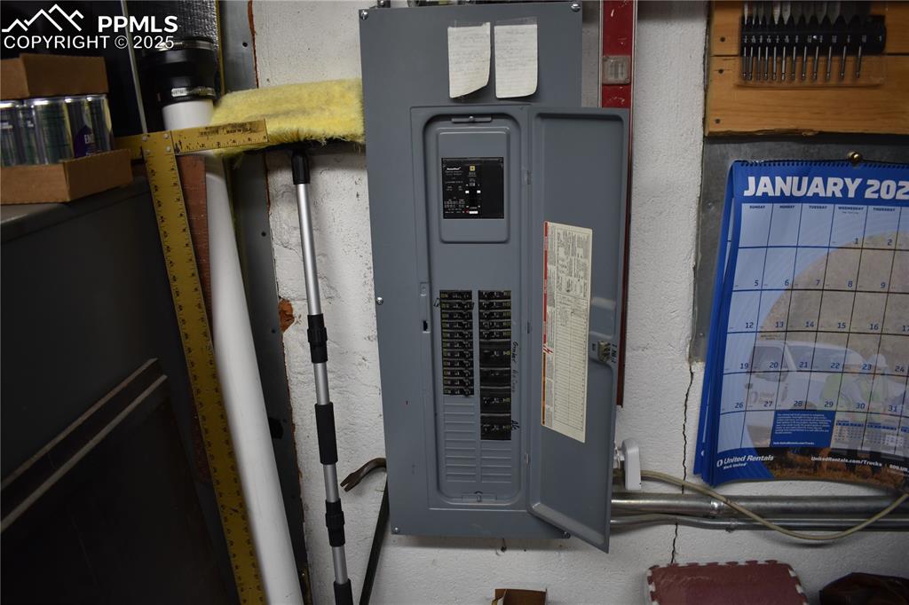 Image 14 of 23: Utility room with electric panel