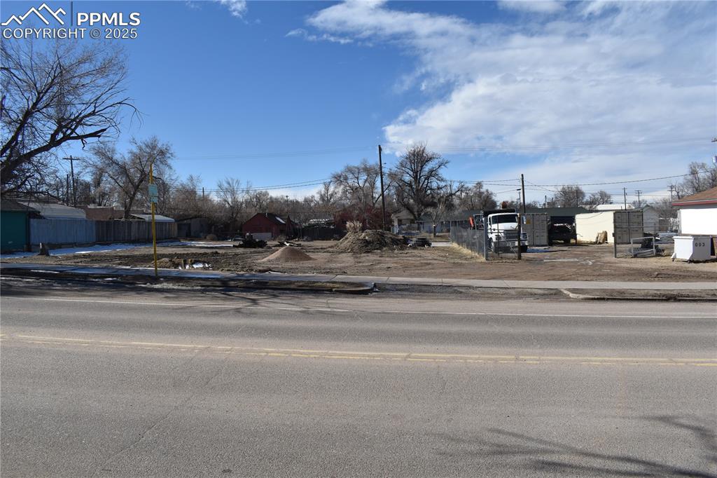 Image 7 of 23: View of asphalt street with sidewalks