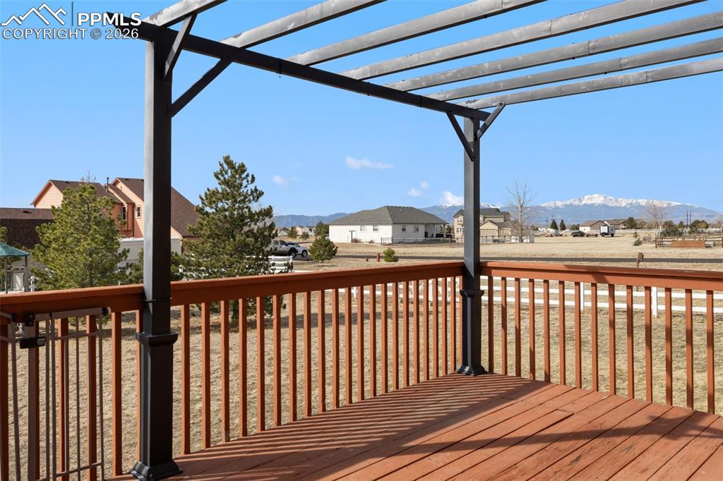 Image 47 of 49: Deck with a residential view and a mountain view