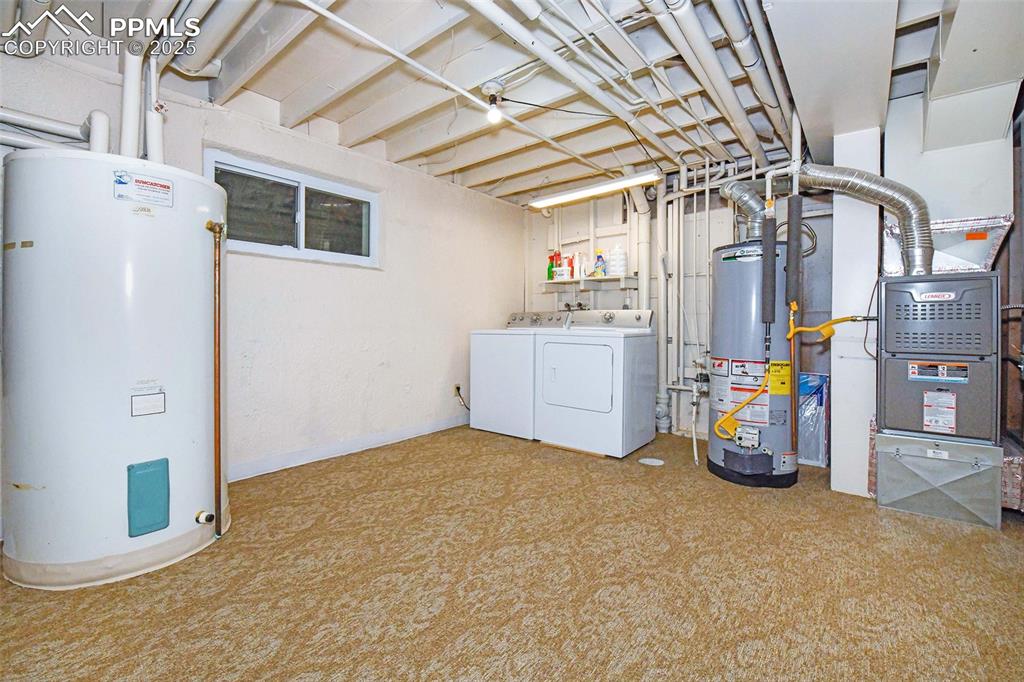 Image 20 of 32: Large laundry room and storage galore