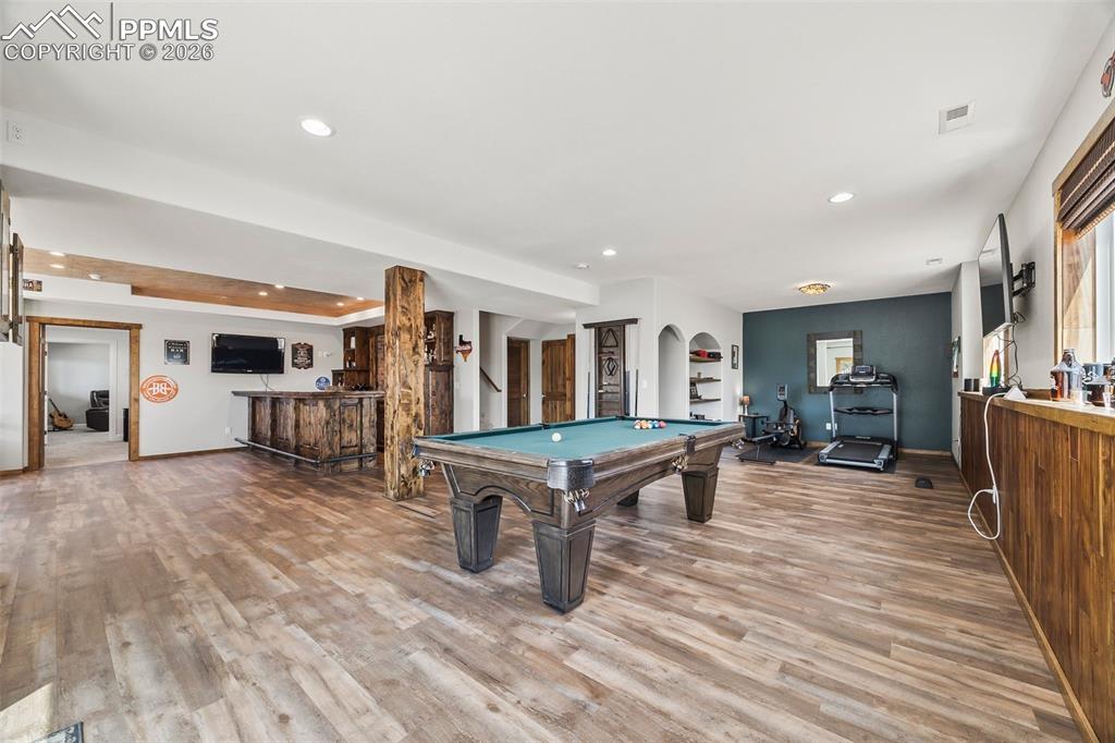 Image 15 of 40: Basement Bar & Entertaining Space