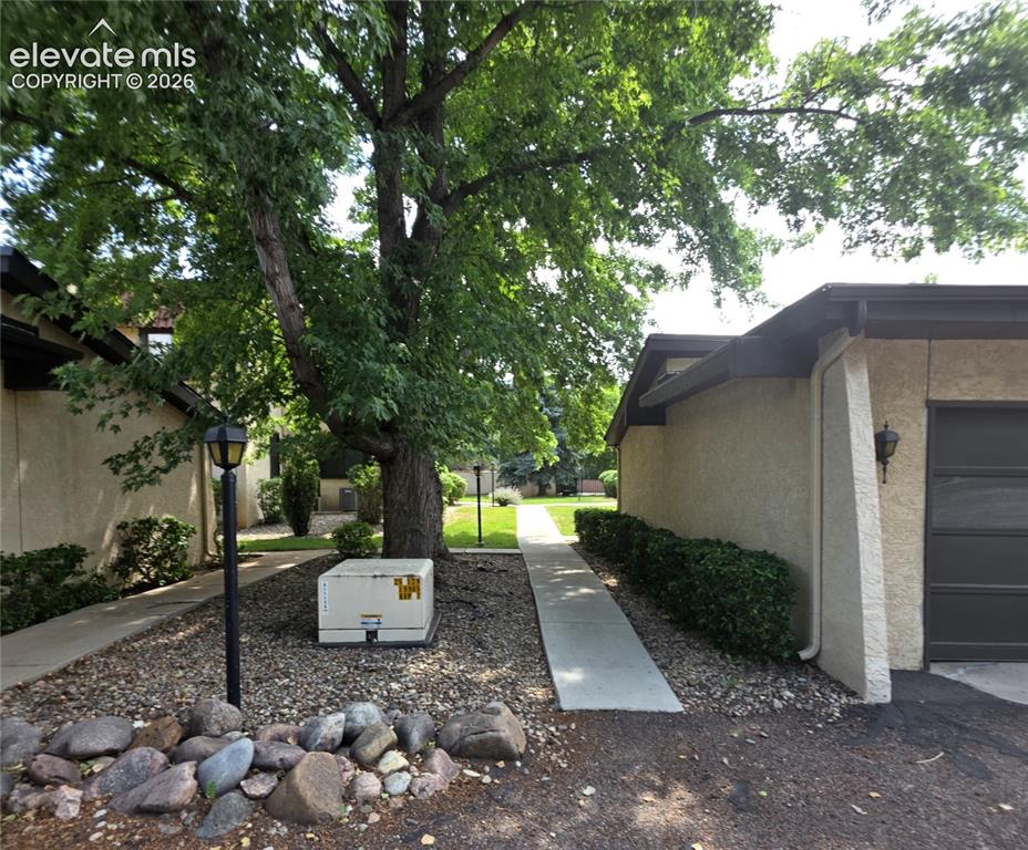 Image 2 of 6: Walkway from the parking lot to the condo
