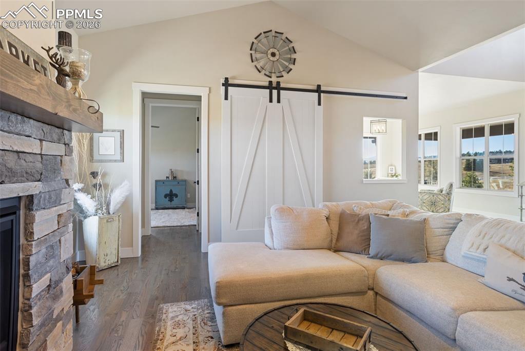 Image 14 of 50: view of media area with barn door closed