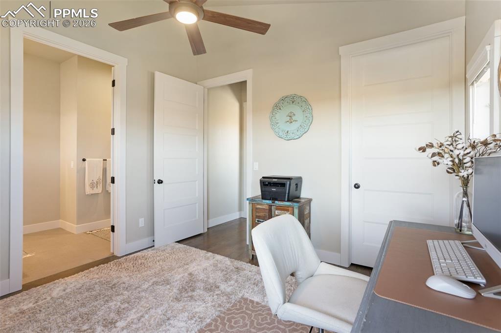 Image 16 of 50: office or bedroom space with walk in closet and attached bathroom