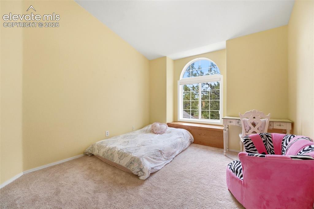 Image 19 of 41: Arch-top window with a wood-finish window seat