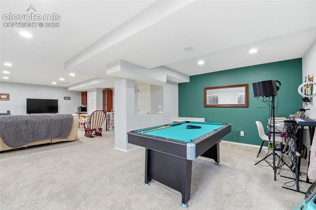 Image 33 of 41: Open-concept recreation room featuring recessed lighting, a built-in pool t