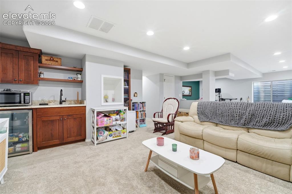 Image 34 of 41: Finished lower level featuring recessed lighting and plush carpet flooring