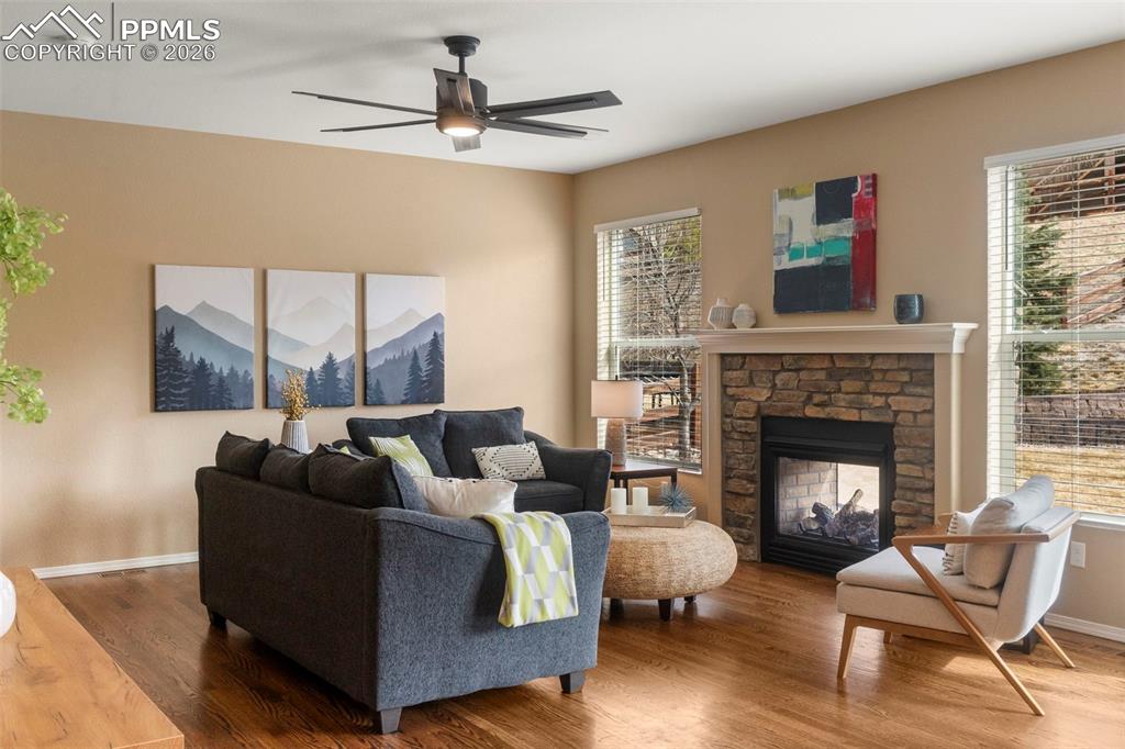 Image 15 of 49: living room with double sided fireplace