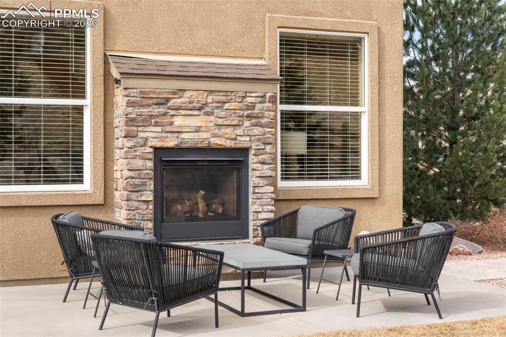 Image 36 of 49: Patio with double sided fireplace