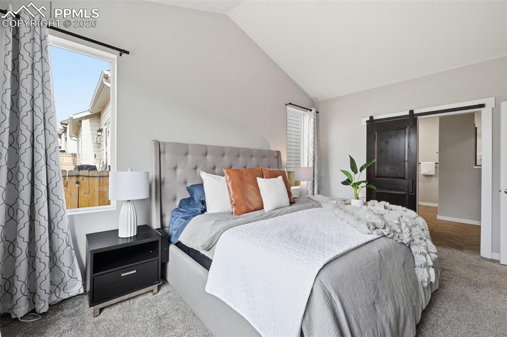 Image 15 of 41: Master Suite with barn door to bathroom