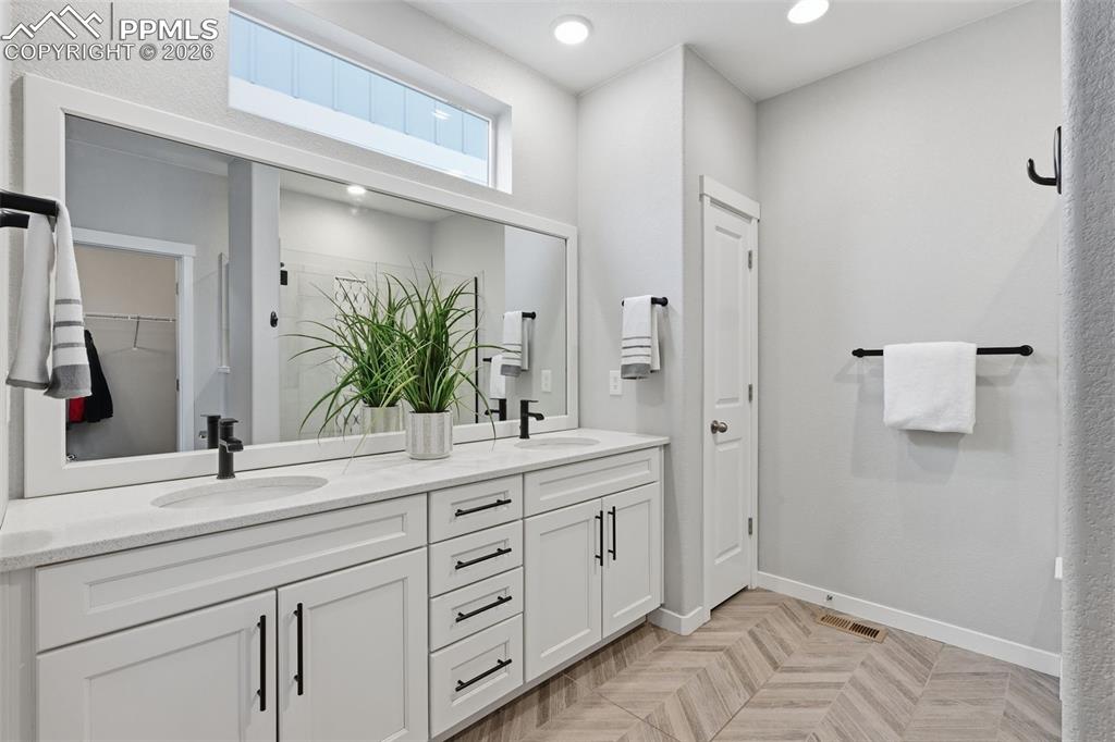 Image 16 of 41: Large Master Bathroom with double vanities