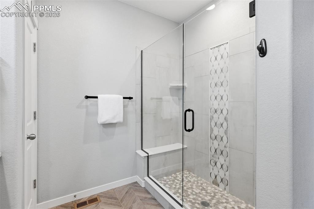 Image 17 of 41: Upgraded tile in the walk-in shower