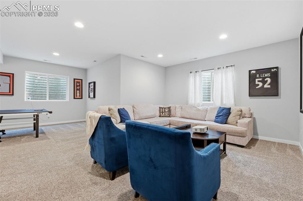 Image 30 of 41: Basement with large windows letting in tons of natural light