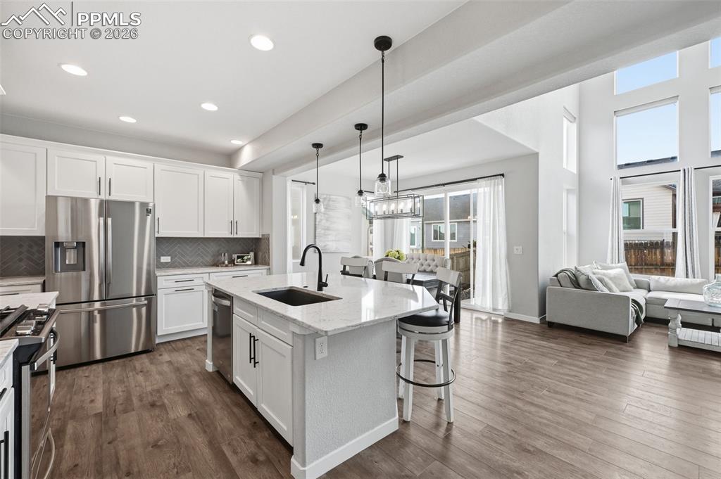 Image 9 of 41: Stunning white cabinets and quartz countertops