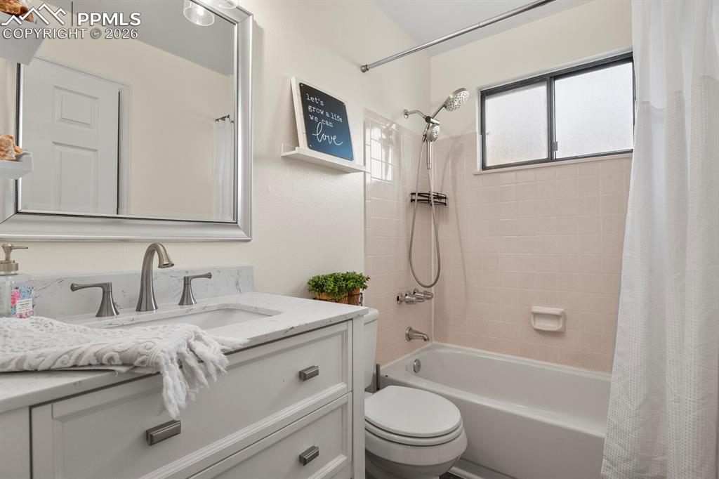 Image 17 of 32: Full bath featuring vanity and shower / bath combo
